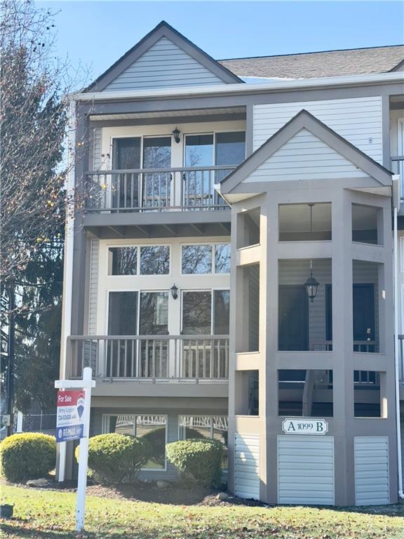 1099 Riverside Drive, Unit A Beaver, PA 15009 - Photo 47 of 49 a front view of a residential apartment building with a yard