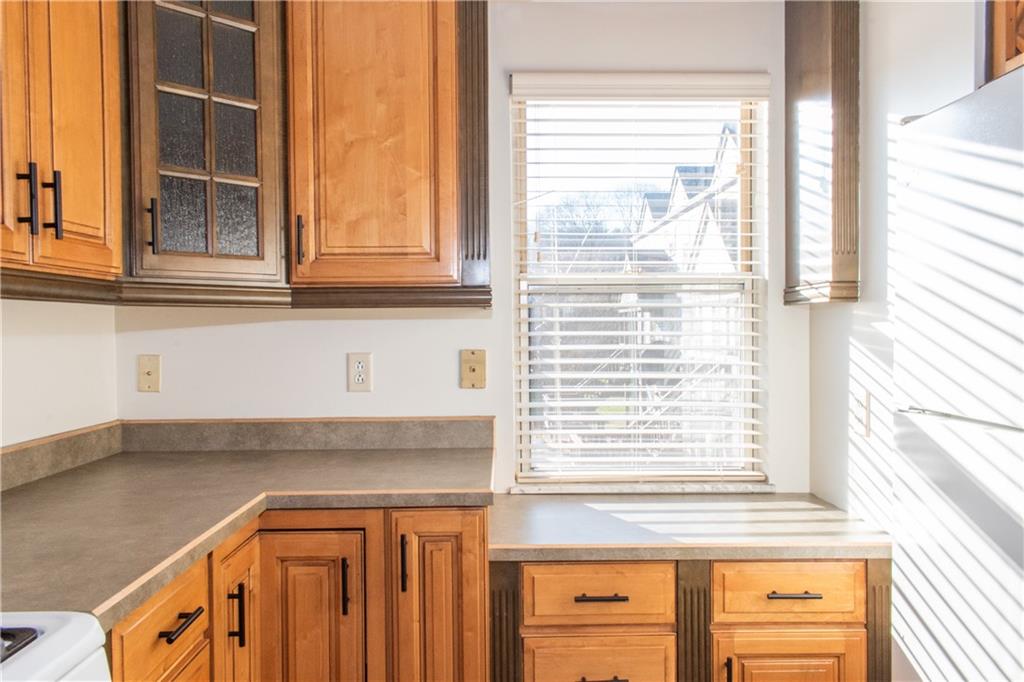 1099 Riverside Drive, Unit A Beaver, PA 15009 - Photo 6 of 49 a kitchen with a window a sink and a window
