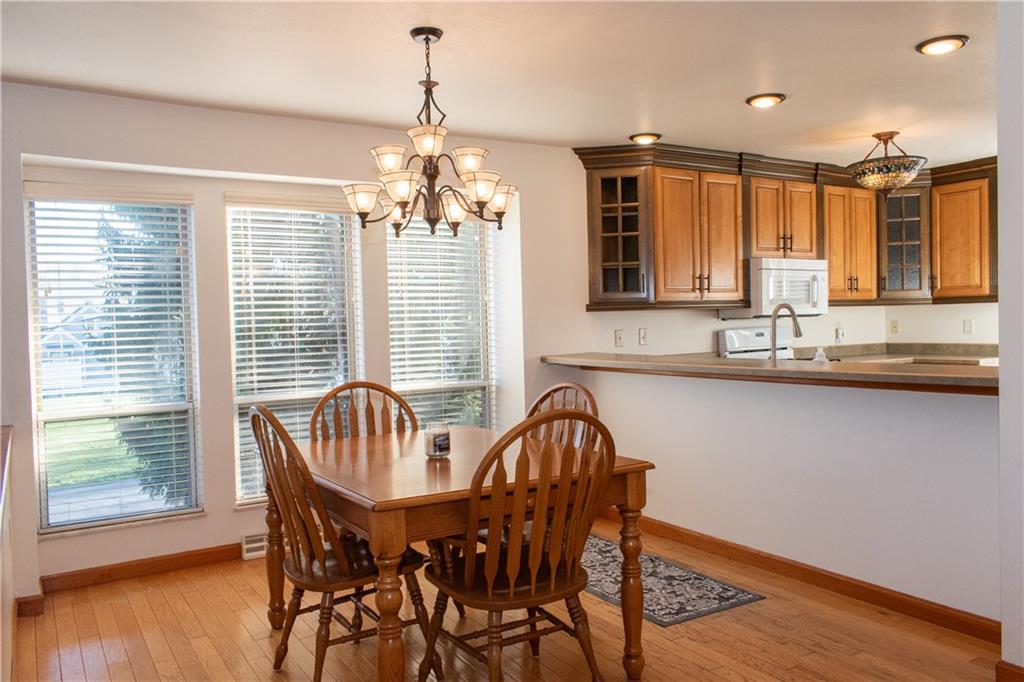 1099 Riverside Drive, Unit A Beaver, PA 15009 - Photo 9 of 49 a view of a dining room with furniture window and wooden floor