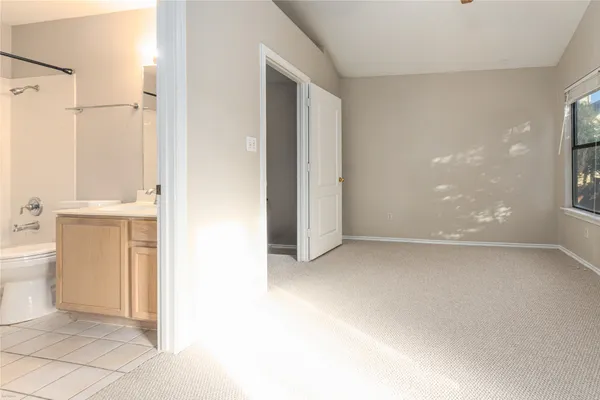 a view of a bathroom with a shower and a toilet