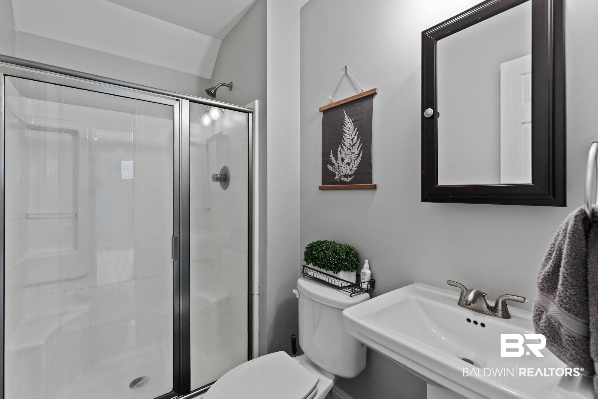 22810 High Ridge Road Fairhope, AL 36532 - Photo 51 of 78 Shower with sliding glass doors and brushed nickel fixtures