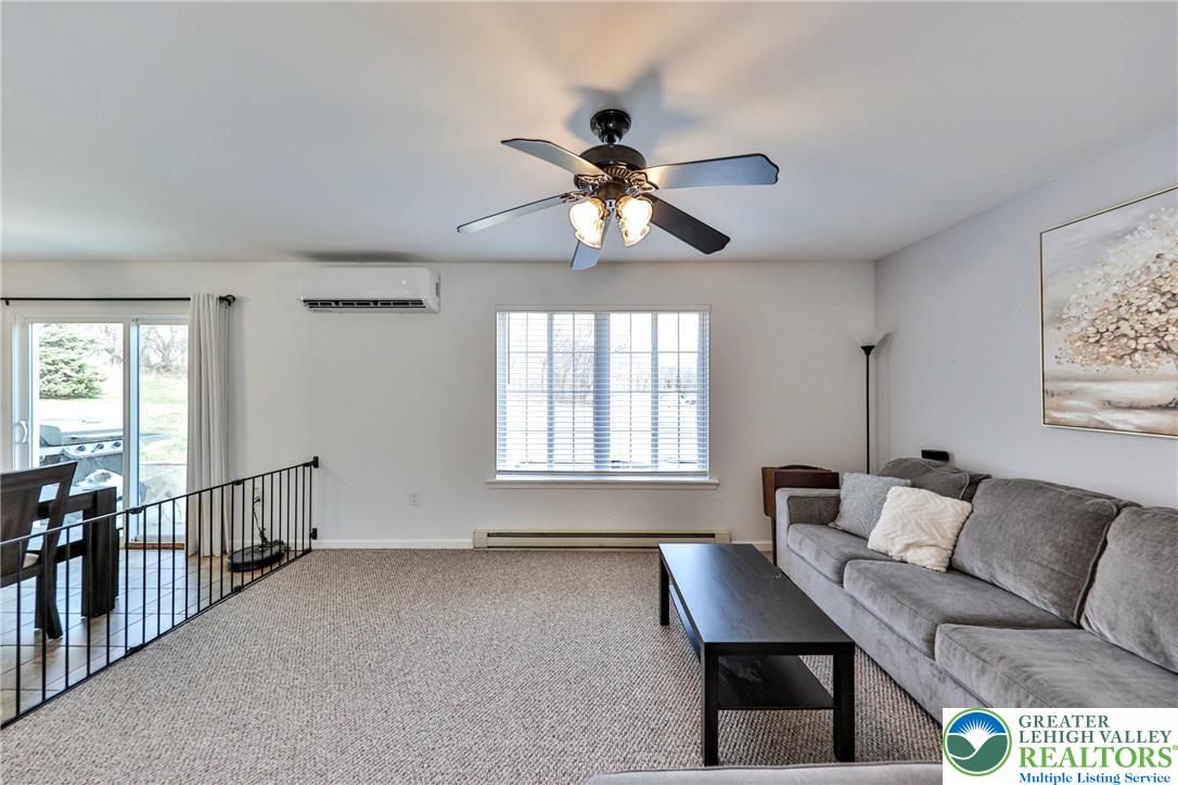 2260 Reo Drive Effort, PA 18330 - Photo 12 of 40 a living room with furniture a chandelier and a window