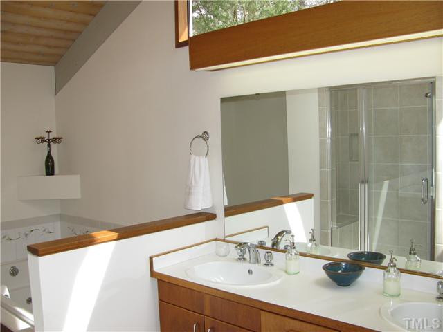 10309 Grafton Road Raleigh, NC 27615 - Photo 12 of 22 Vaulted Master Bath features double vanity, jacuzzi type tub, separate shower with new tile, enormous walk-in closet and dressing area. Master Bath/Spa