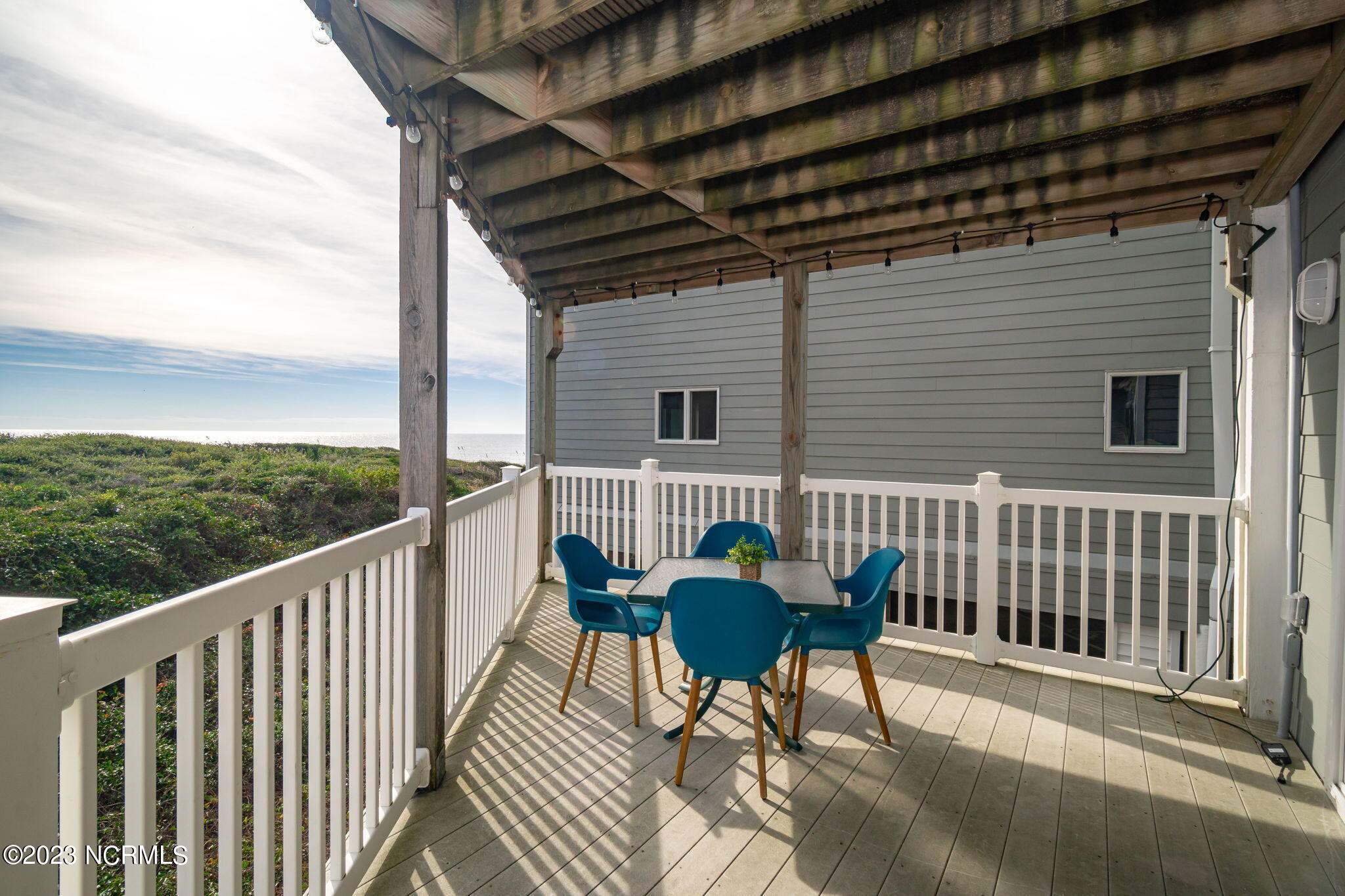 855 Salter Path Road, Unit 121 Indian Beach, NC 28512 - Photo 9 of 46 Covered porch w/ ocean views