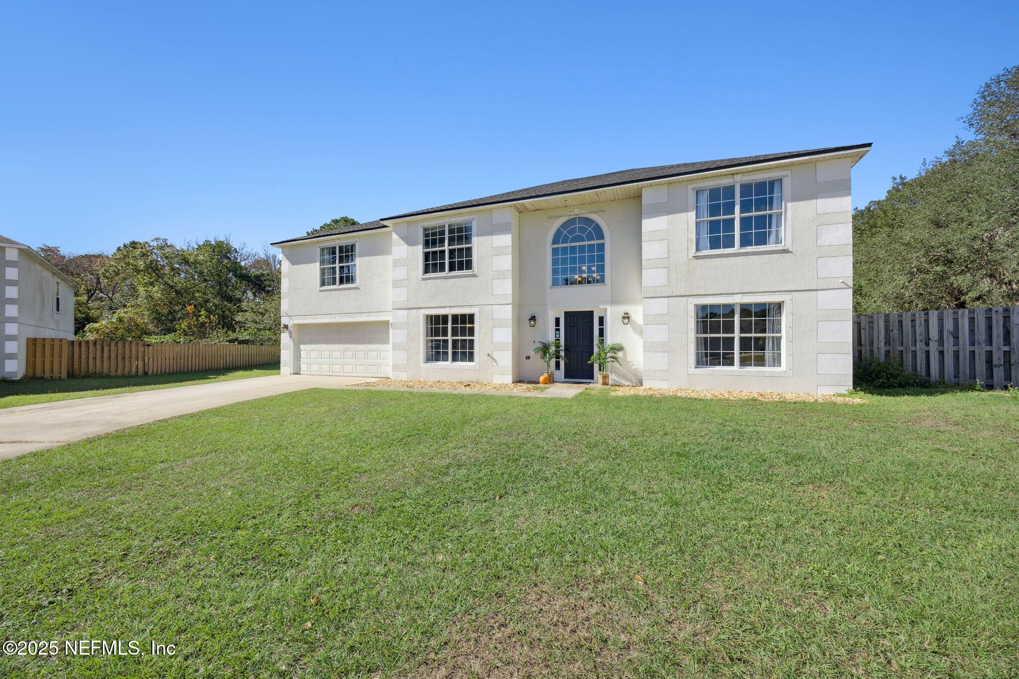 87002 Kip Lane Yulee, FL 32097 - Photo 11 of 54 a house view with a garden space