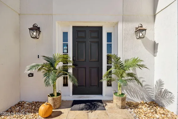 a view of bathroom with a potted plant