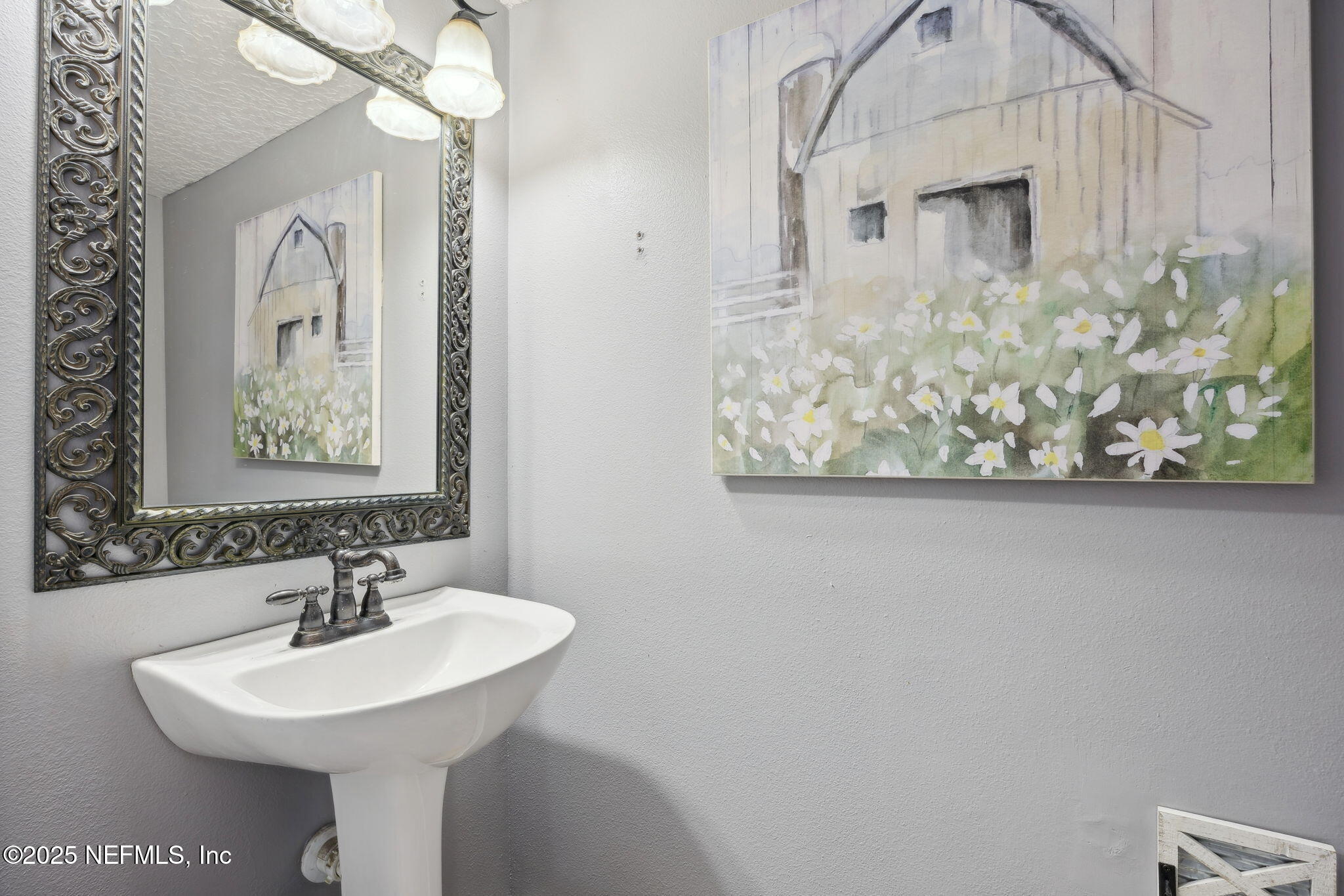 87002 Kip Lane Yulee, FL 32097 - Photo 20 of 54 a bathroom with a sink and a mirror