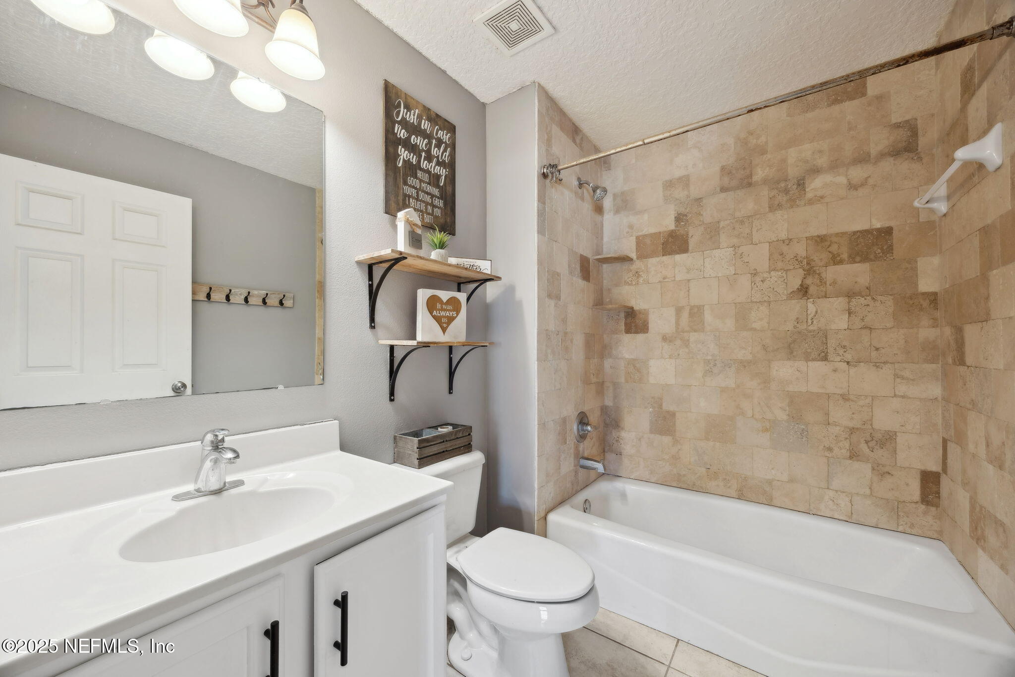 87002 Kip Lane Yulee, FL 32097 - Photo 37 of 54 a bathroom with a sink toilet and shower