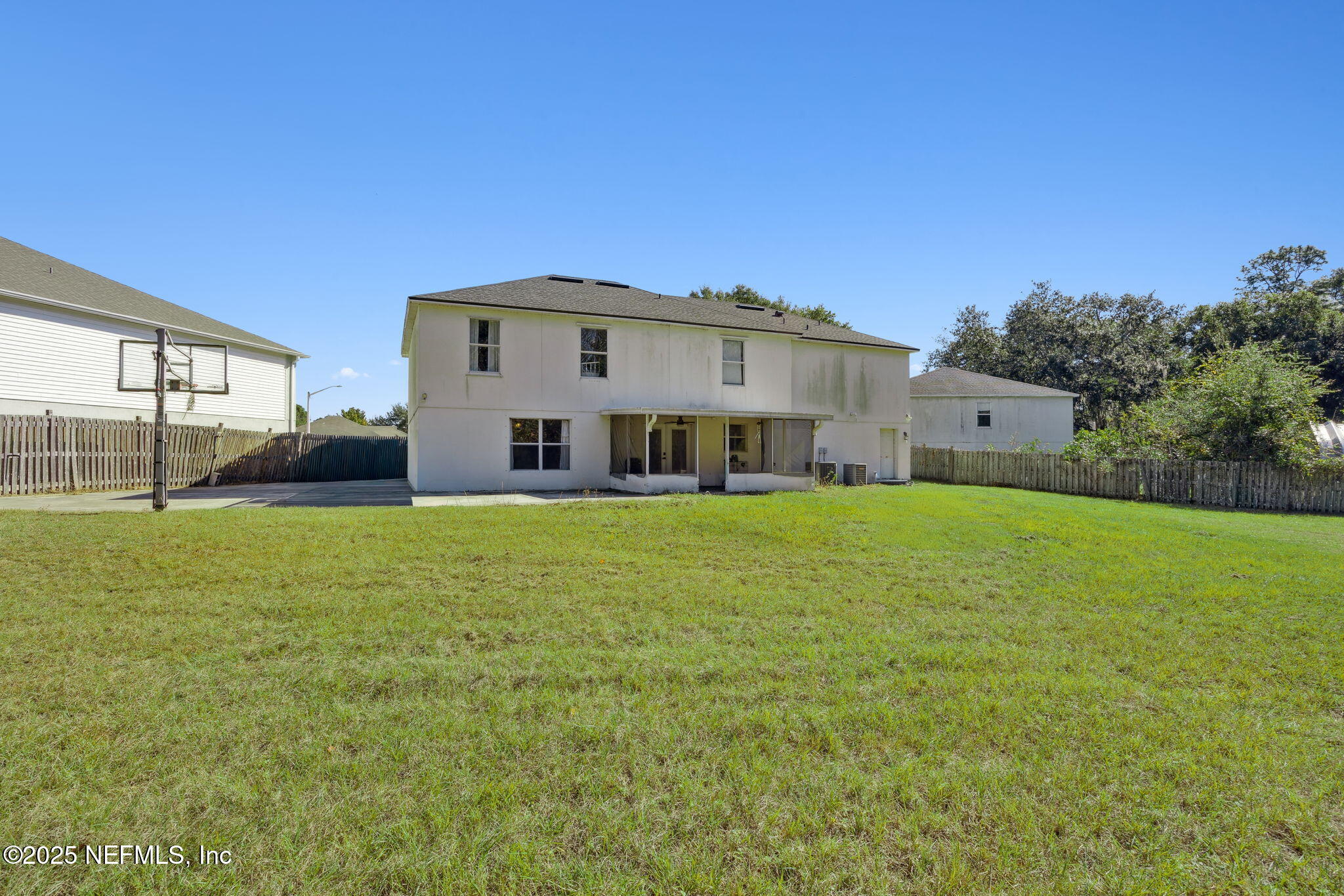 87002 Kip Lane Yulee, FL 32097 - Photo 38 of 54 a front view of a house with a yard