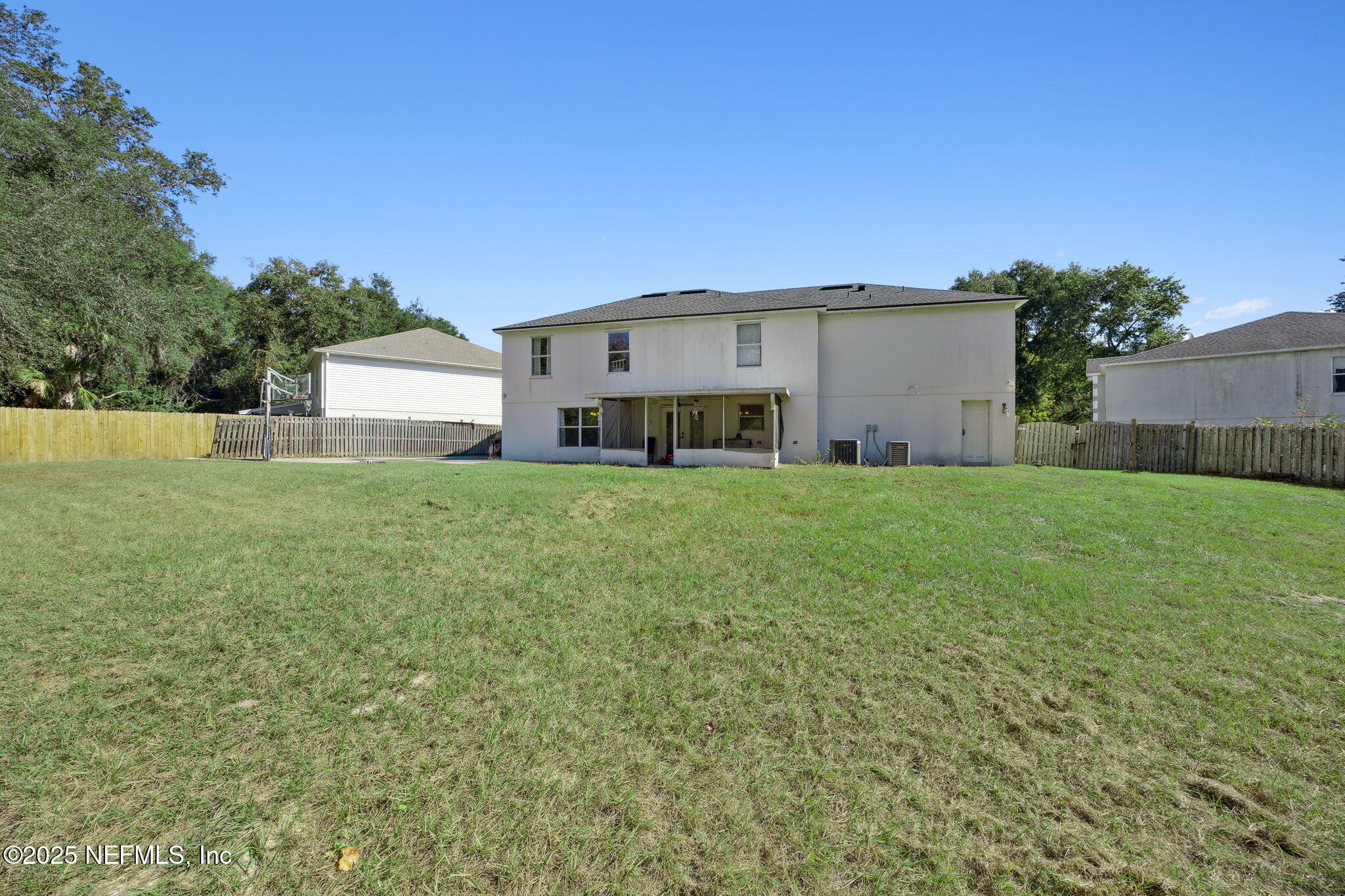 87002 Kip Lane Yulee, FL 32097 - Photo 40 of 54 a view of a house with a yard