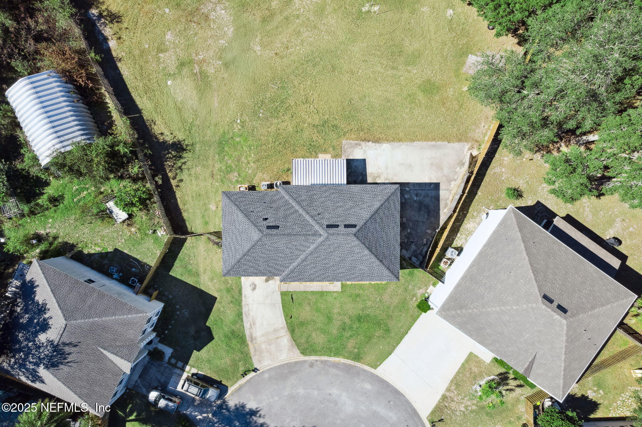 87002 Kip Lane Yulee, FL 32097 - Photo 42 of 54 an aerial view of a house with a yard and mountain view
