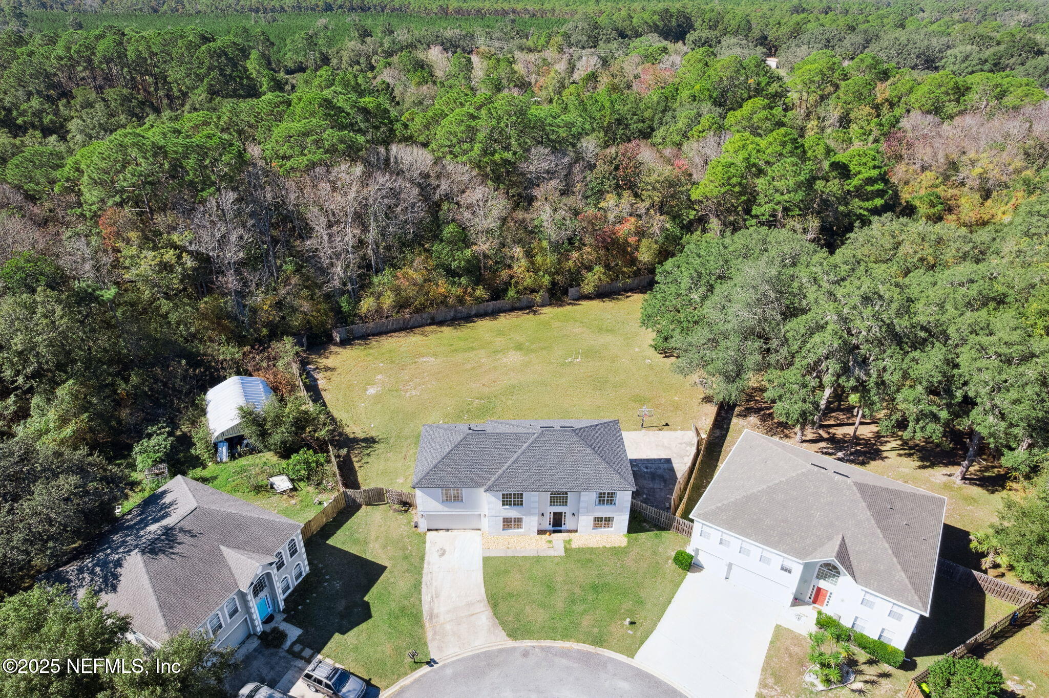 87002 Kip Lane Yulee, FL 32097 - Photo 7 of 54 an aerial view of a house with a yard