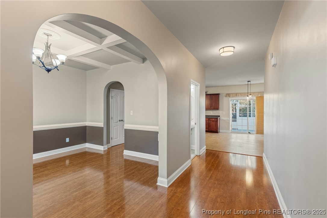 305 Home Stretch Lane Raeford, NC 28376 - Photo 7 of 35 wooden floor in an empty room with a window