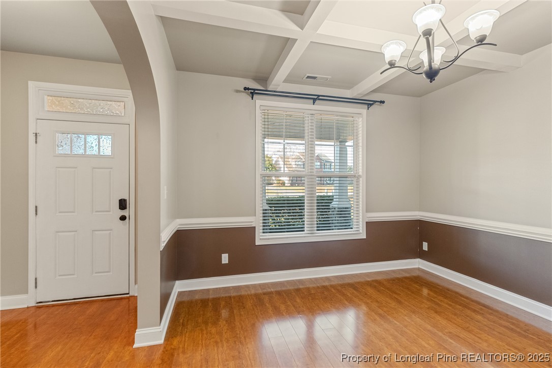 305 Home Stretch Lane Raeford, NC 28376 - Photo 10 of 35 a view of an empty room with wooden floor and a window