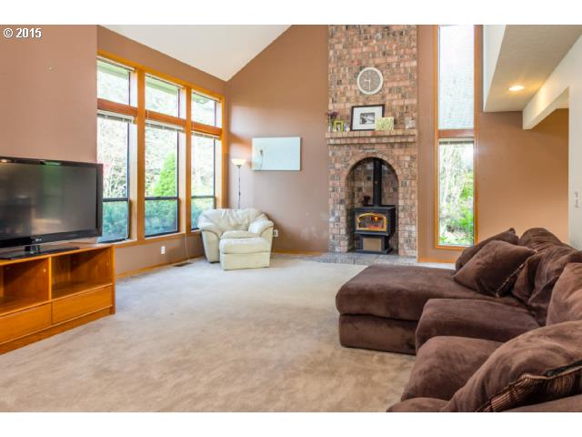 21240 South Springwater Road Estacada, OR 97023 - Photo 3 of 16 a living room with furniture and a flat screen tv
