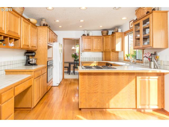 21240 South Springwater Road Estacada, OR 97023 - Photo 5 of 16 a kitchen with stainless steel appliances granite countertop a sink and cabinets