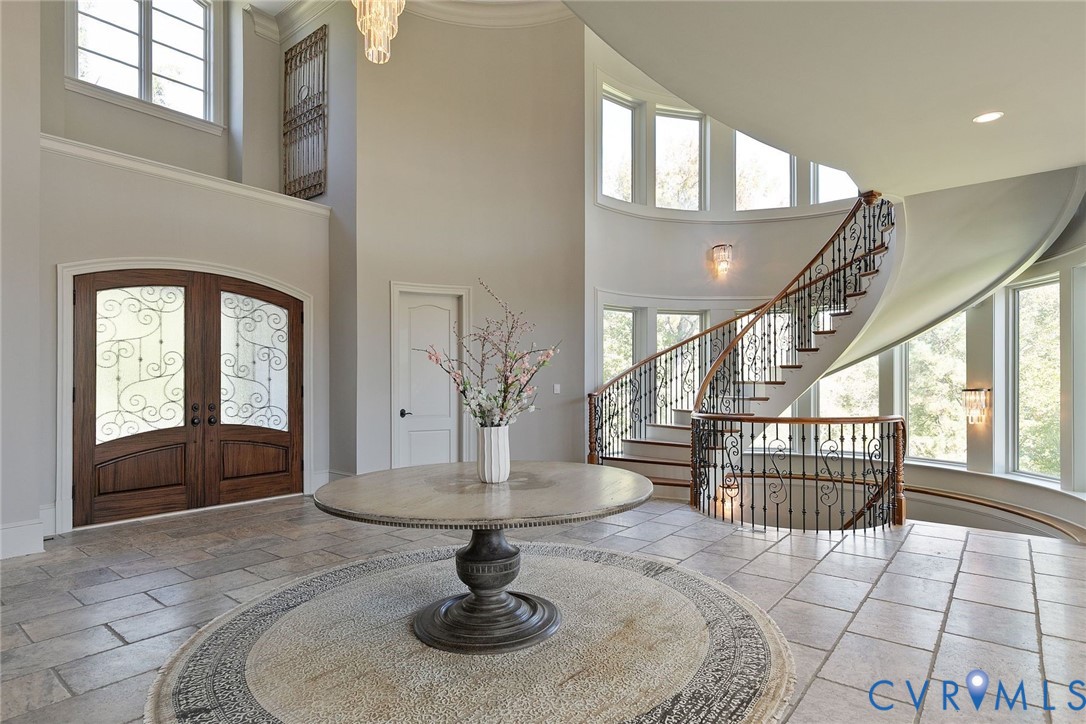 785 Oak Spring Lane Manakin-Sabot, VA 23103 - Photo 5 of 96 Showstopping curved staircases to upper and lower