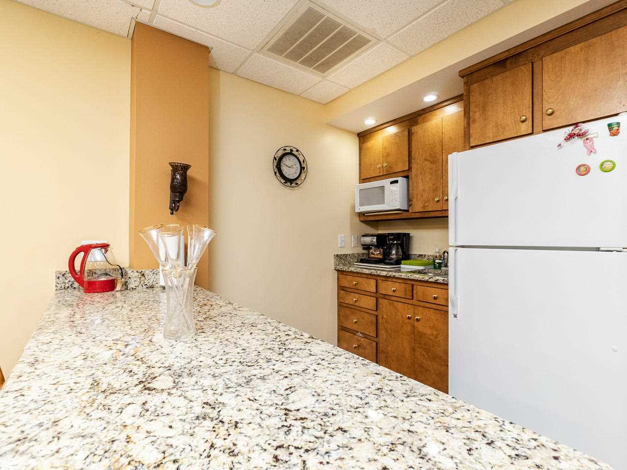 6815 Holly Springs Road Raleigh, NC 27606 - Photo 19 of 30 Lower level kitchen