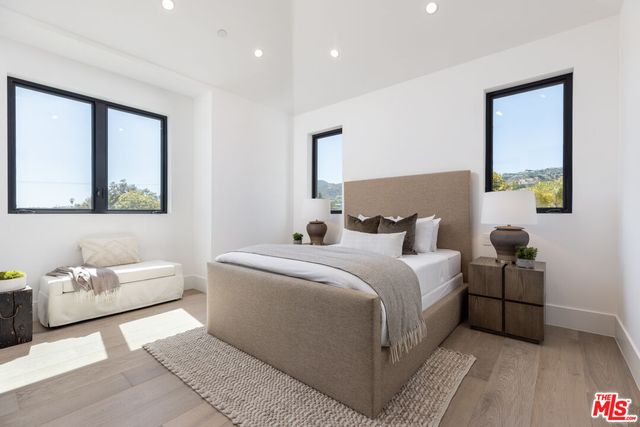 a bedroom with bed and a couch