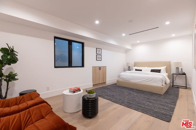 a bedroom with a bed and furniture