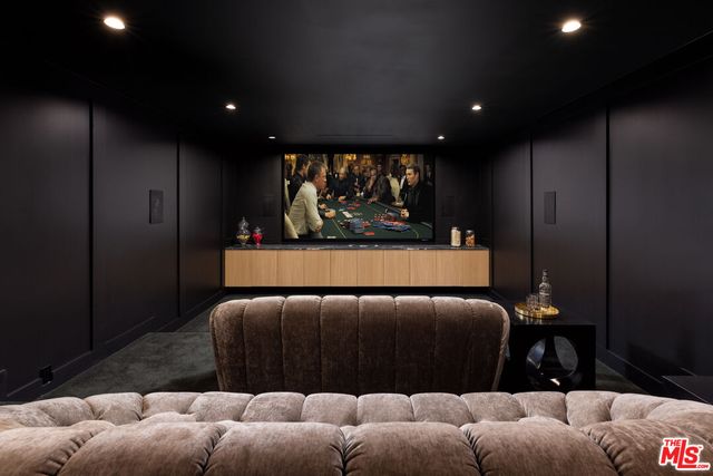 a living room with furniture and a projector