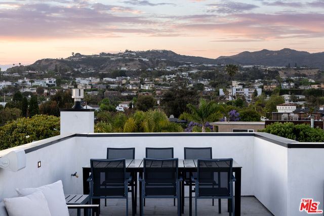 a view of a chairs and table in the terrace