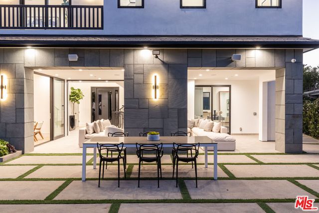 a living room with a table and chairs