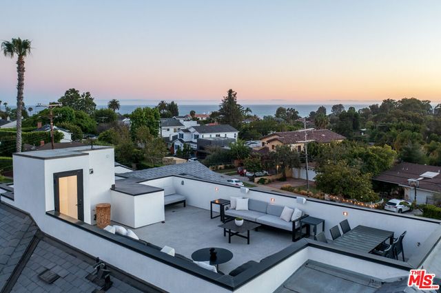 an aerial view of a house with porch