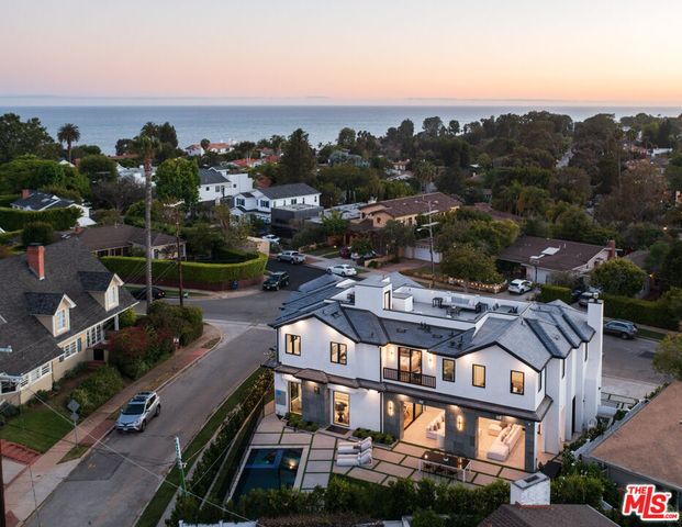 an aerial view of a house with a mountain view