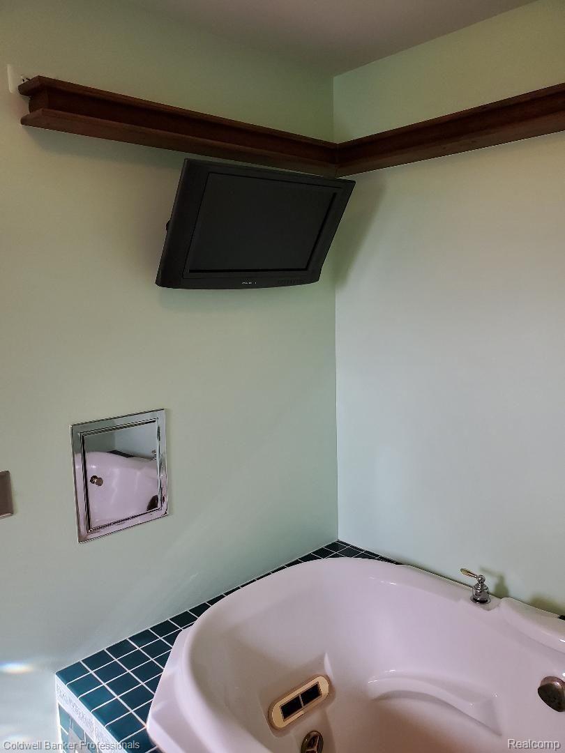 11315 Lambs Road Memphis, MI 48041 - Photo 26 of 62 49 Inch TV Stays, Metal Laundry Shoot Door!