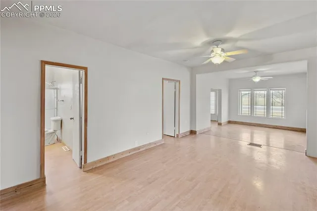 a view of an empty room with a window