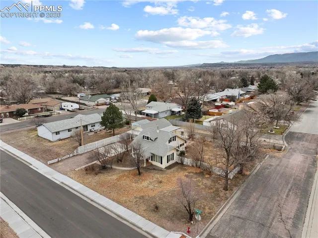 an aerial view of residential houses with outdoor space