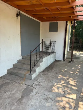 a view of a house with a tree