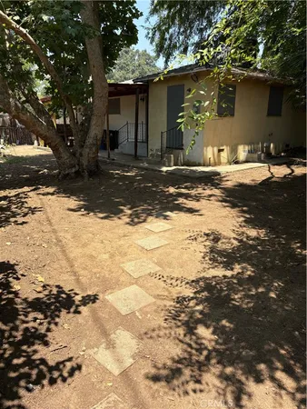 a view of a house with a tree
