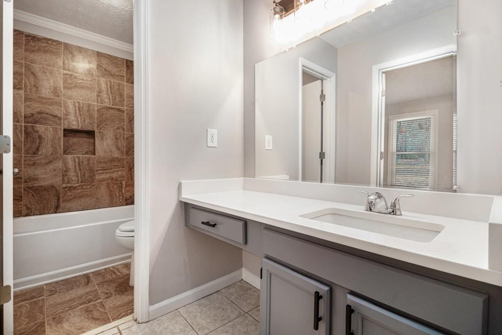 5524 Dorsett Shoals Road Douglasville, GA 30135 - Photo 11 of 33 a bathroom with a sink and a mirror