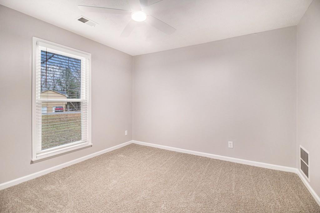 5524 Dorsett Shoals Road Douglasville, GA 30135 - Photo 16 of 33 an empty room with a window