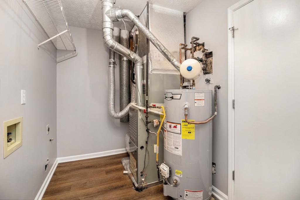 5524 Dorsett Shoals Road Douglasville, GA 30135 - Photo 18 of 33 a view of hallway with stairs and wooden floor