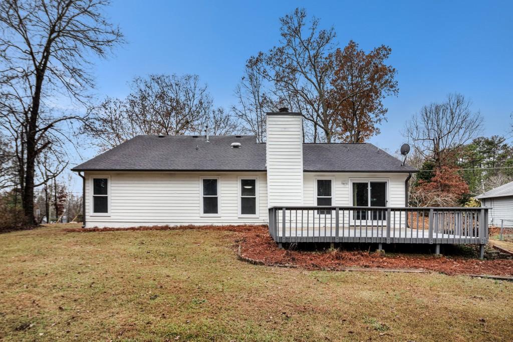 5524 Dorsett Shoals Road Douglasville, GA 30135 - Photo 22 of 33 a front view of a house with a yard