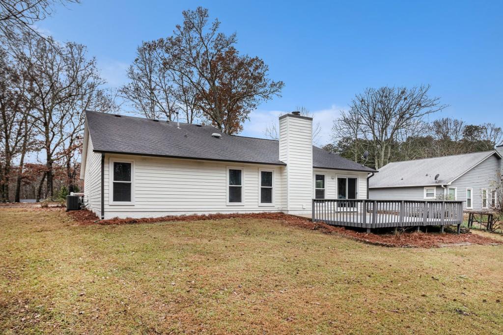 5524 Dorsett Shoals Road Douglasville, GA 30135 - Photo 23 of 33 a house that has a tree in front of it