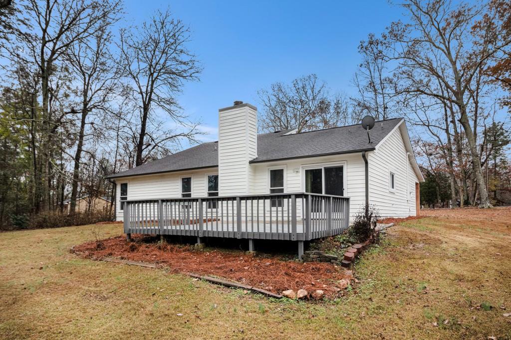 5524 Dorsett Shoals Road Douglasville, GA 30135 - Photo 24 of 33 a view of a house with a yard