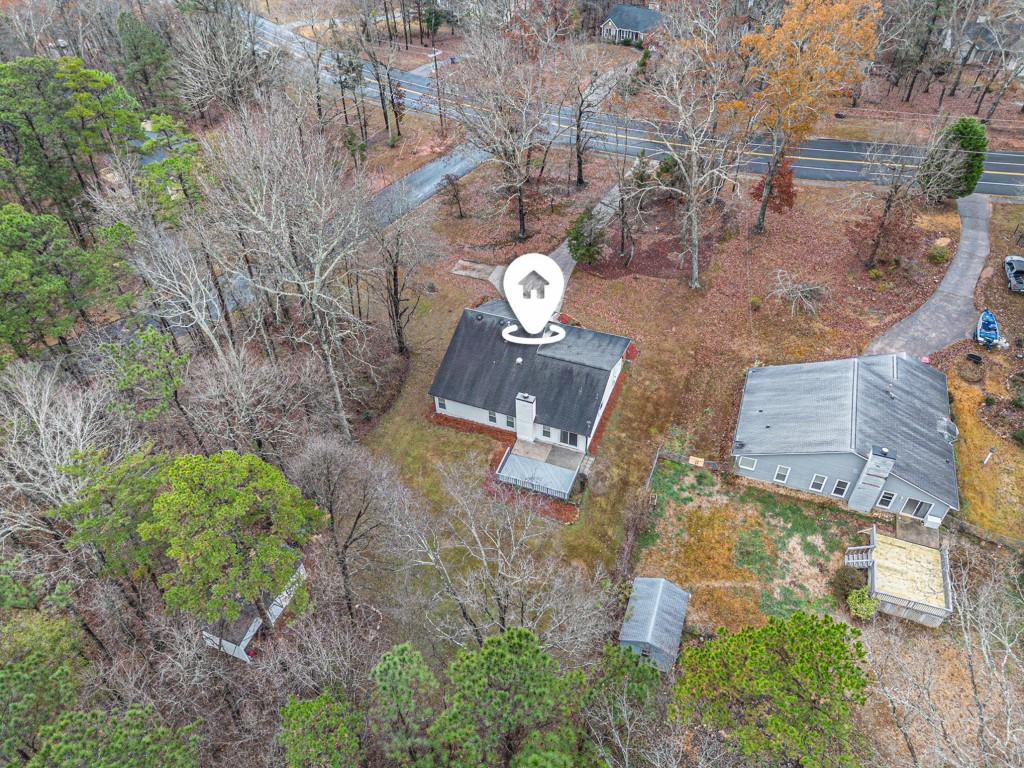 5524 Dorsett Shoals Road Douglasville, GA 30135 - Photo 25 of 33 an aerial view of a house with a yard