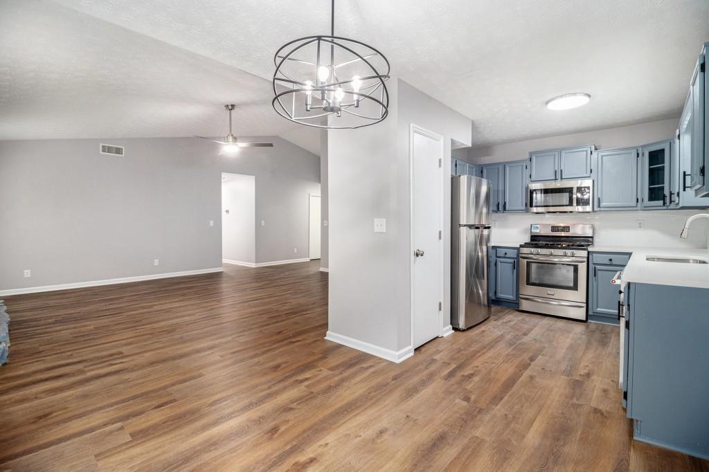 5524 Dorsett Shoals Road Douglasville, GA 30135 - Photo 6 of 33 a view of a kitchen with microwave and cabinets