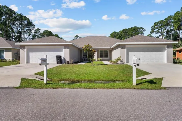 front view of a house with a yard