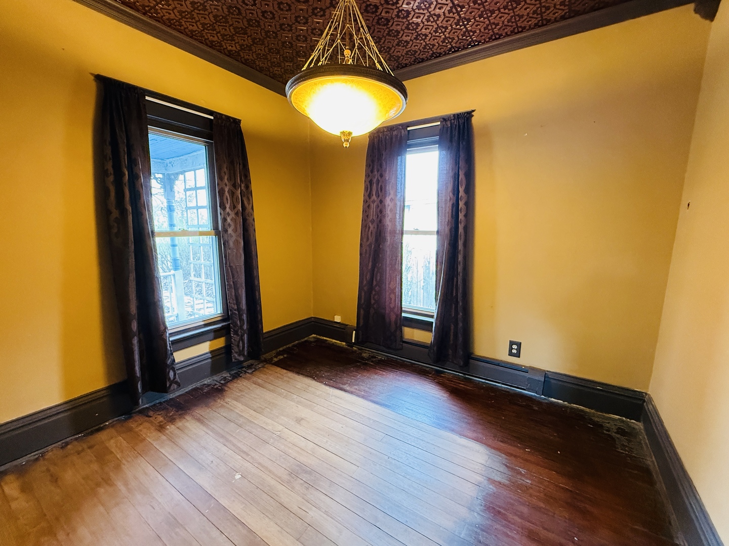 312 North Chicago Street Dwight, IL 60420 - Photo 13 of 16 a view of a room with wooden floor and windows