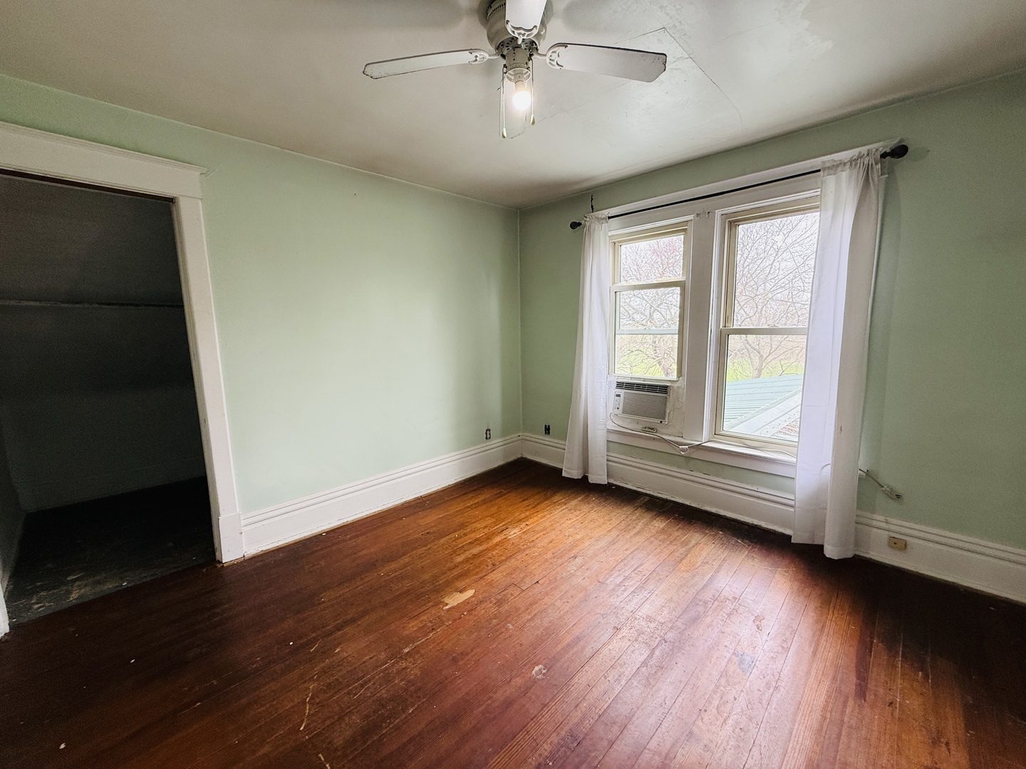 312 North Chicago Street Dwight, IL 60420 - Photo 14 of 16 a view of wooden floor and windows in a room