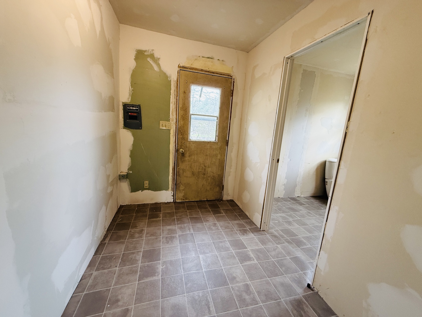 312 North Chicago Street Dwight, IL 60420 - Photo 15 of 16 a view of a hallway with wooden floor and a bathroom