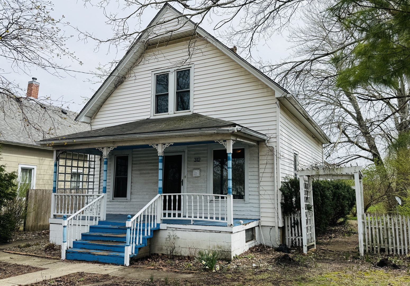 312 North Chicago Street Dwight, IL 60420 - Photo 2 of 16 a view of a house with a small deck and a large tree
