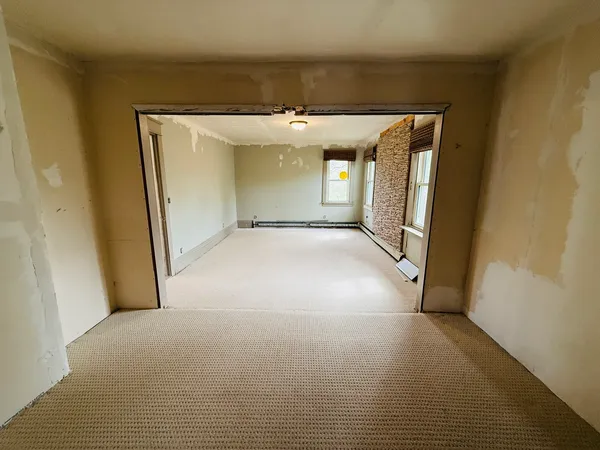 a view of an empty room with a window