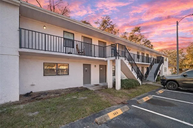 a front view of a house with parking space