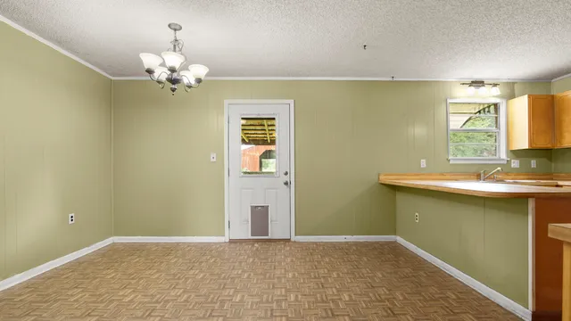 a bathroom with a granite countertop sink a mirror and a shower